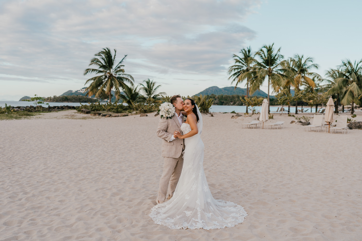 bride and groom on the beach at stolentime resort saint lucia wedding venue