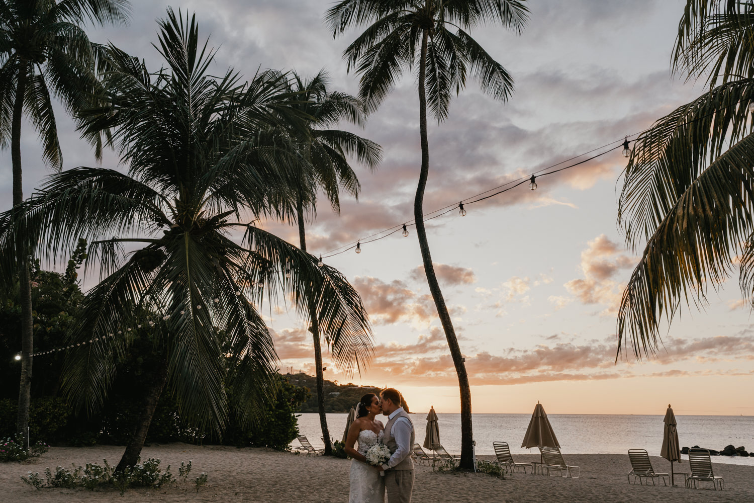 bride and groom on the beach at sunset at stolentime resort in saint lucia wedding