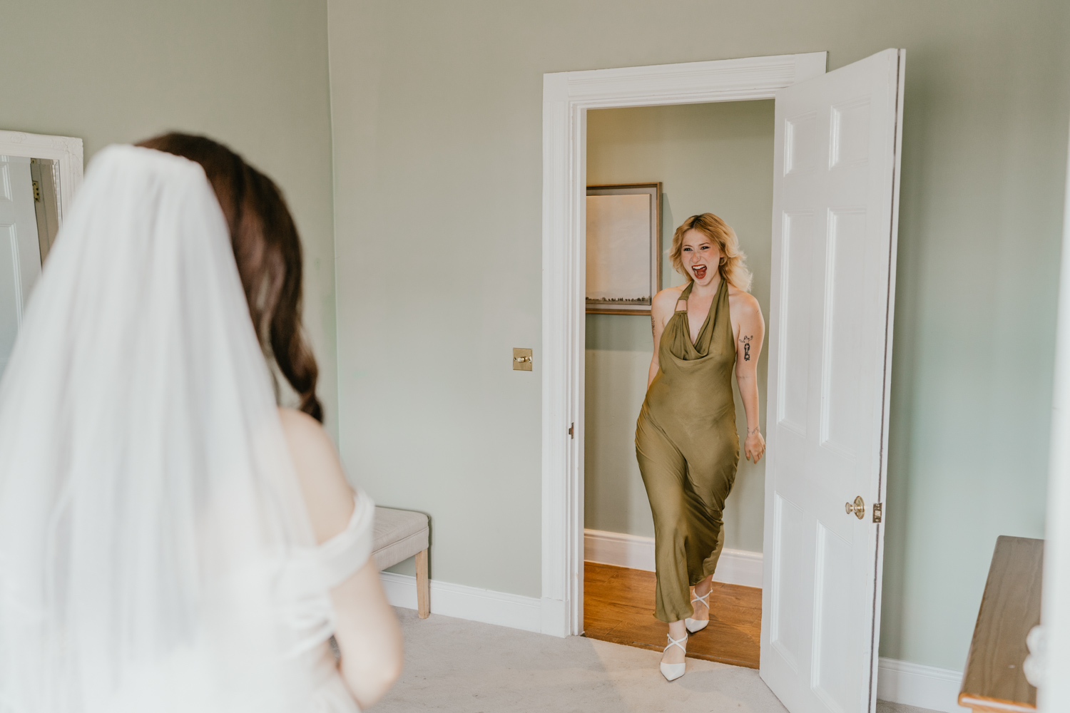 bridesmaid reaction to bride reveal at northbrook park wedding