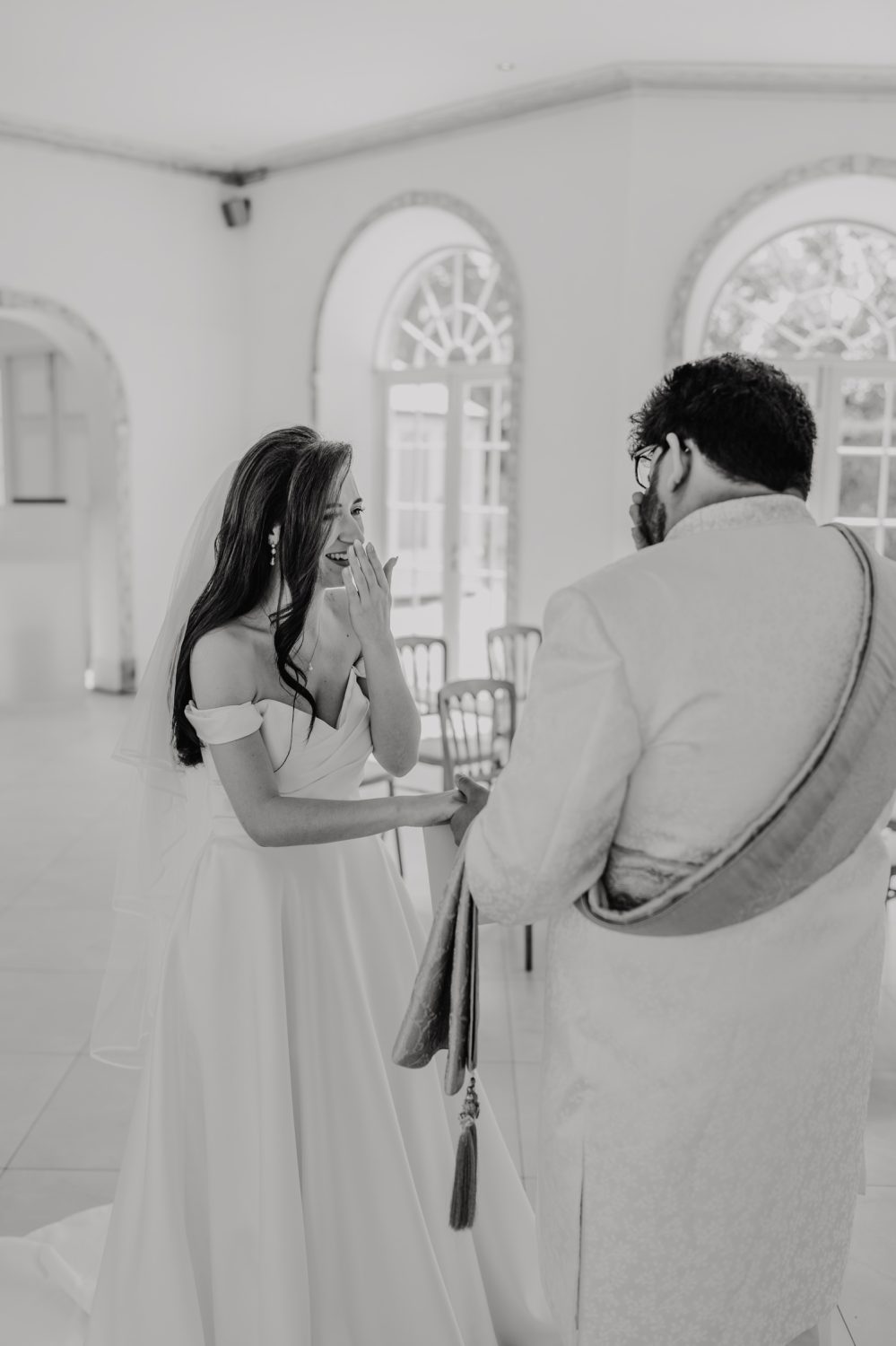 black and white photo of bride and groom first look at northbrook park wedding