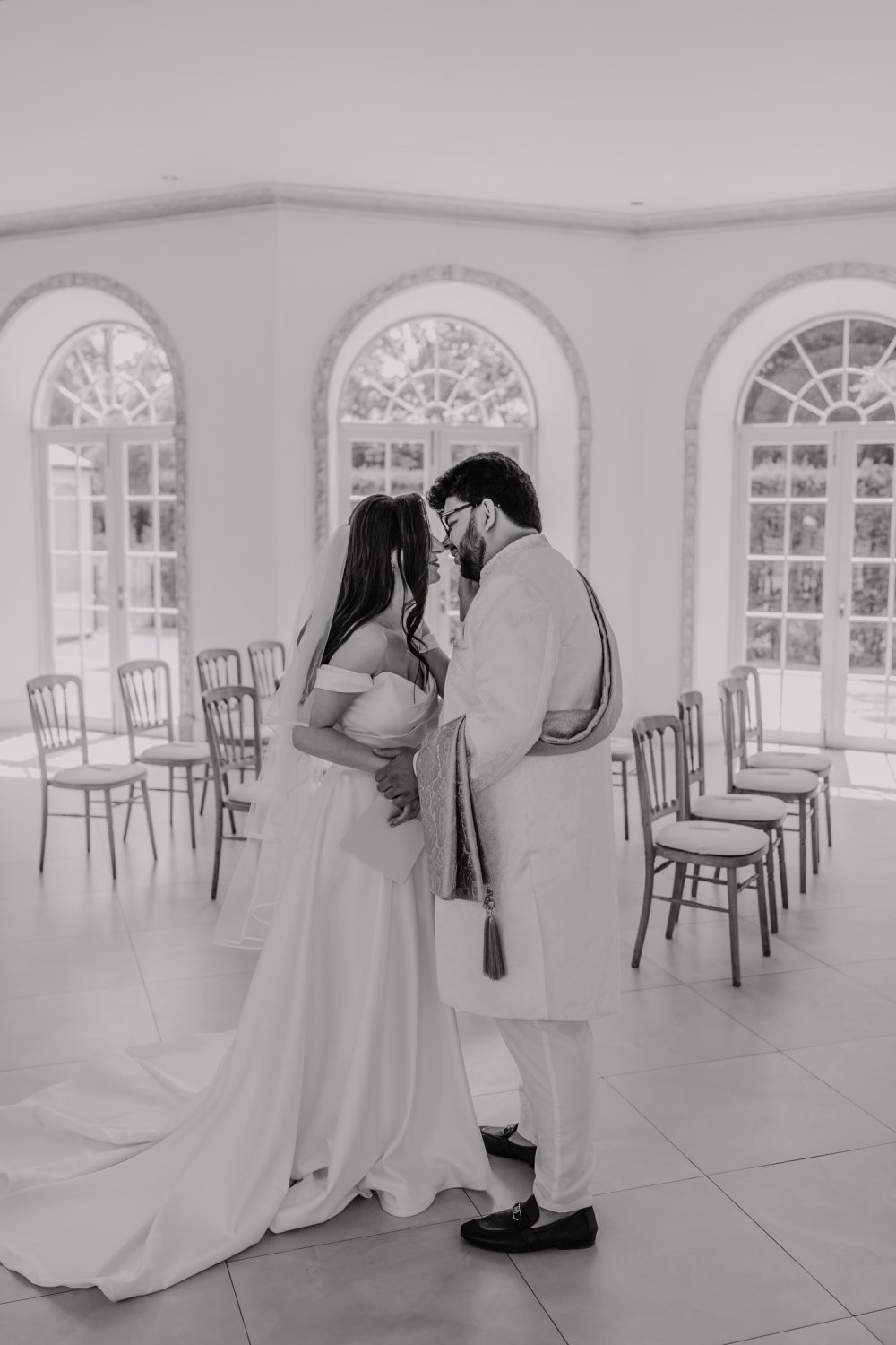 black and white photo of bride and groom first look at northbrook park wedding