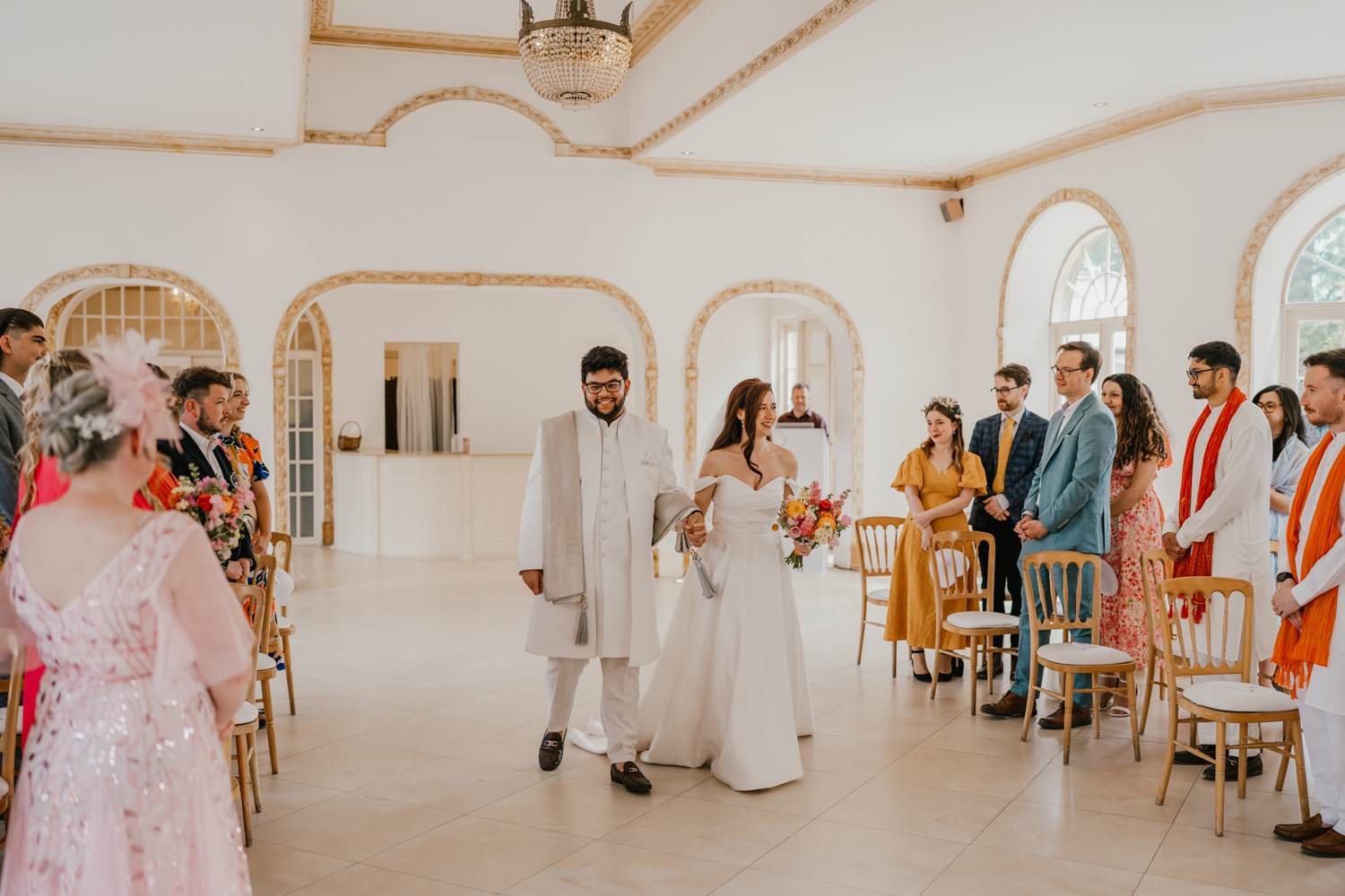 bride and groom walk down the aisle together at northbrook park wedding ceremony