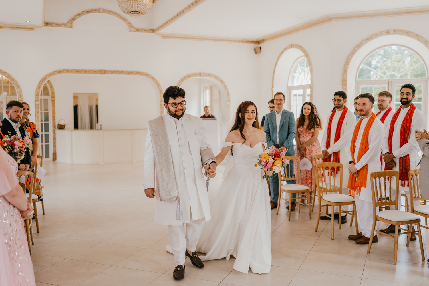 bride and groom walk down the aisle together at northbrook park wedding