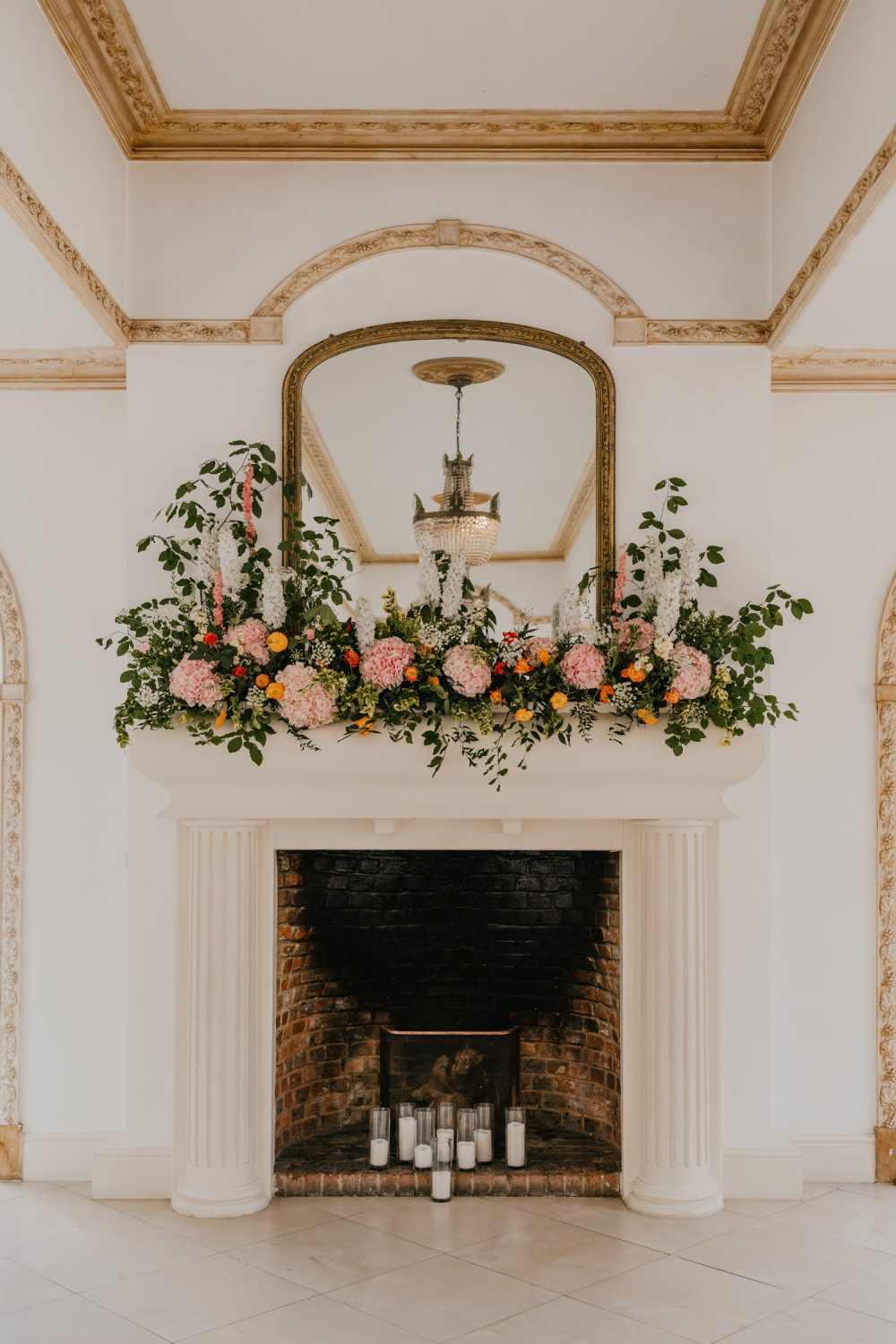 floral display on the fireplace for wedding ceremony at northbrook park