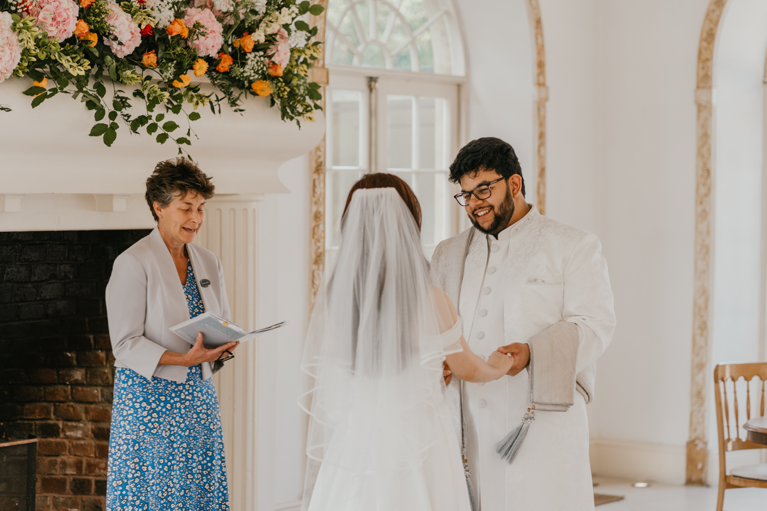 bride and groom exchange vows at northbrook park wedding