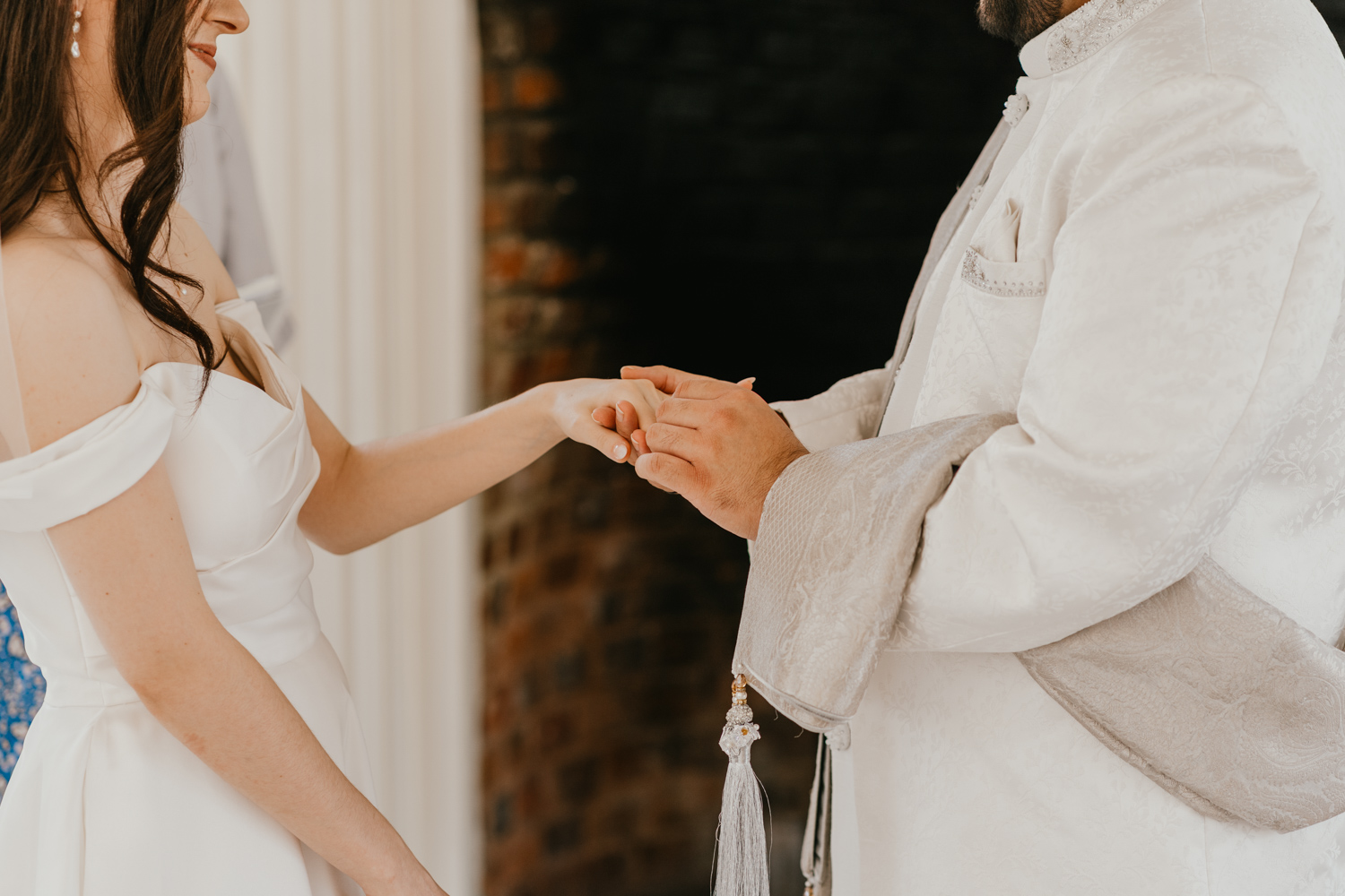 bride and groom exchange rings at northbrook park wedding