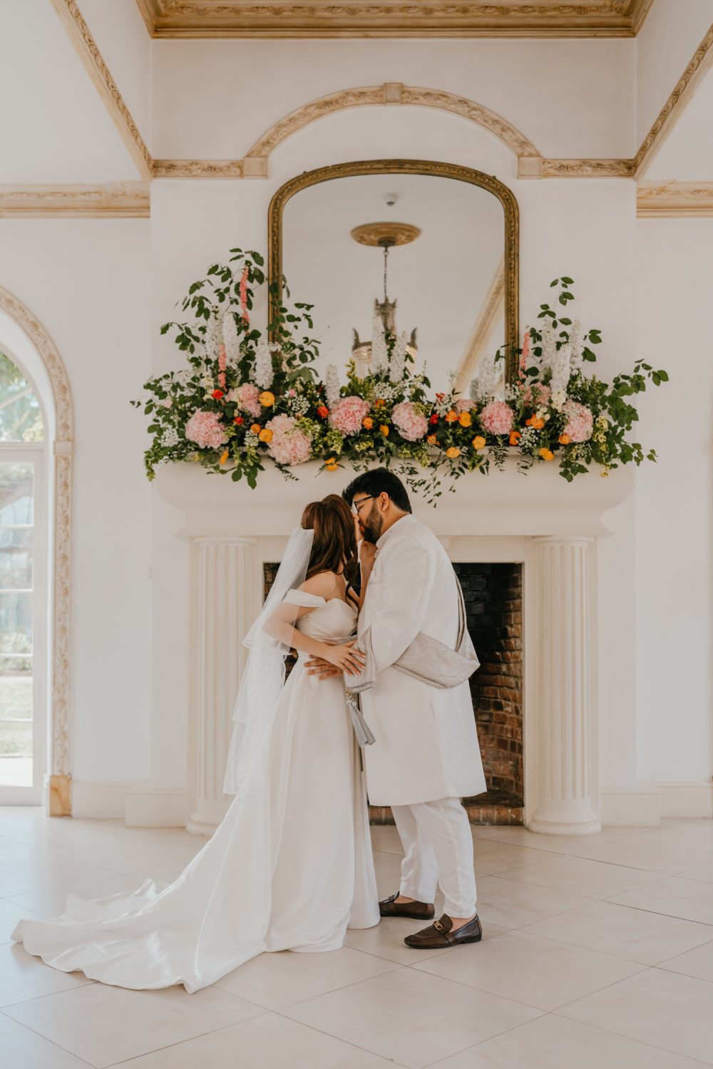 bride and groom first kiss at northbrook park wedding