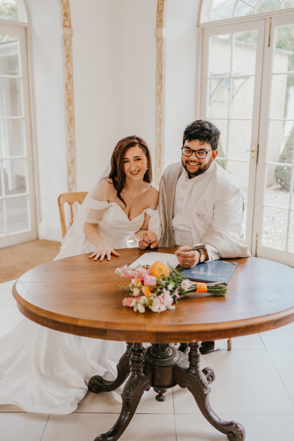 bride and groom celebrate after wedding ceremony at northbrook park in farnham