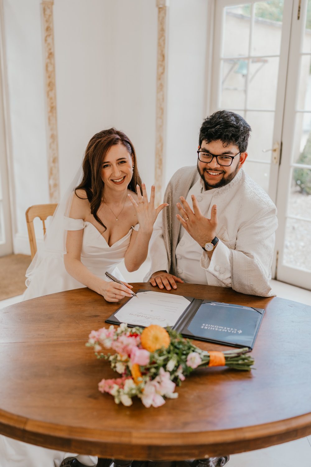 bride and groom celebrate after wedding ceremony at northbrook park in farnham