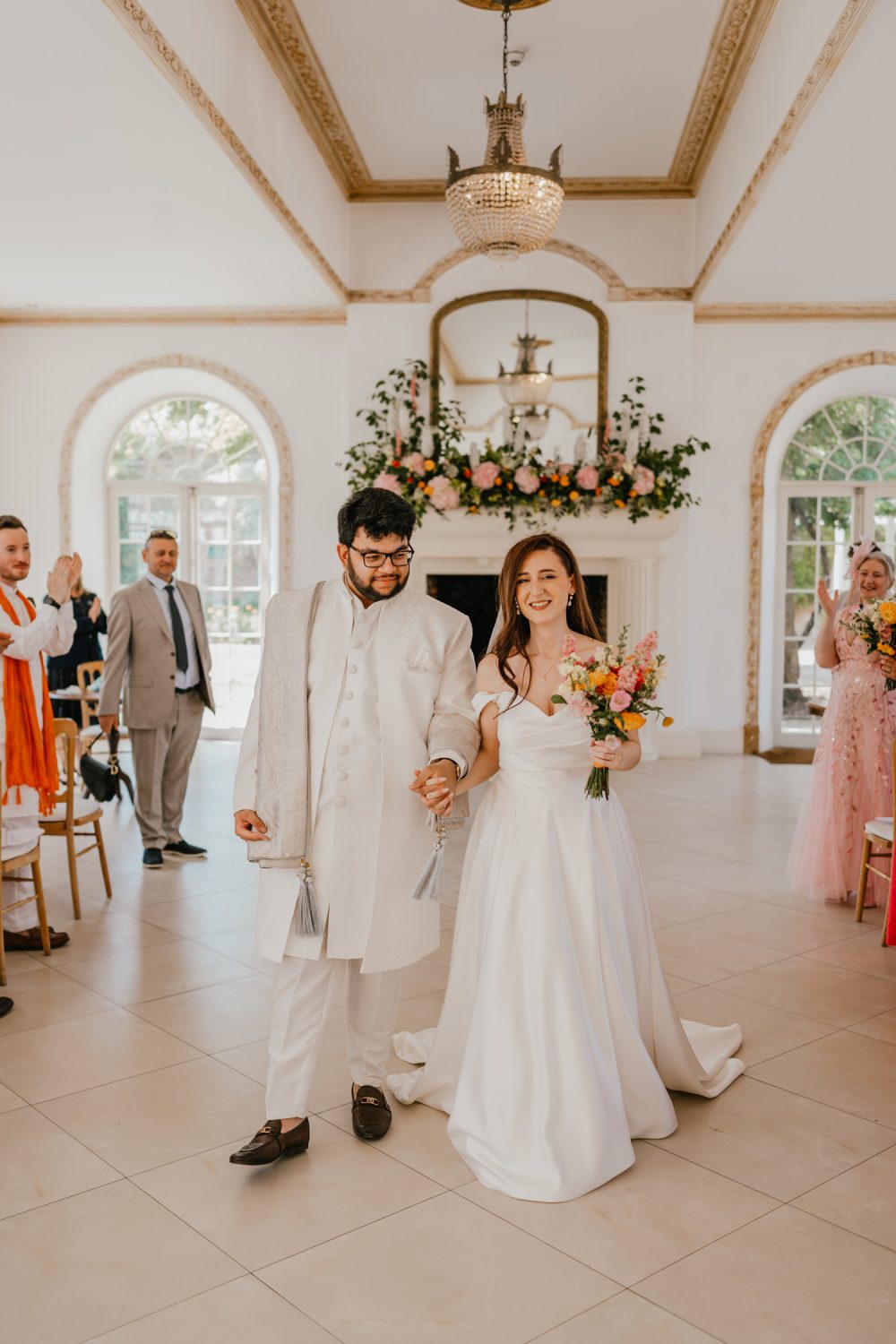 bride and groom recessional after wedding ceremony at northbrook park in farnham