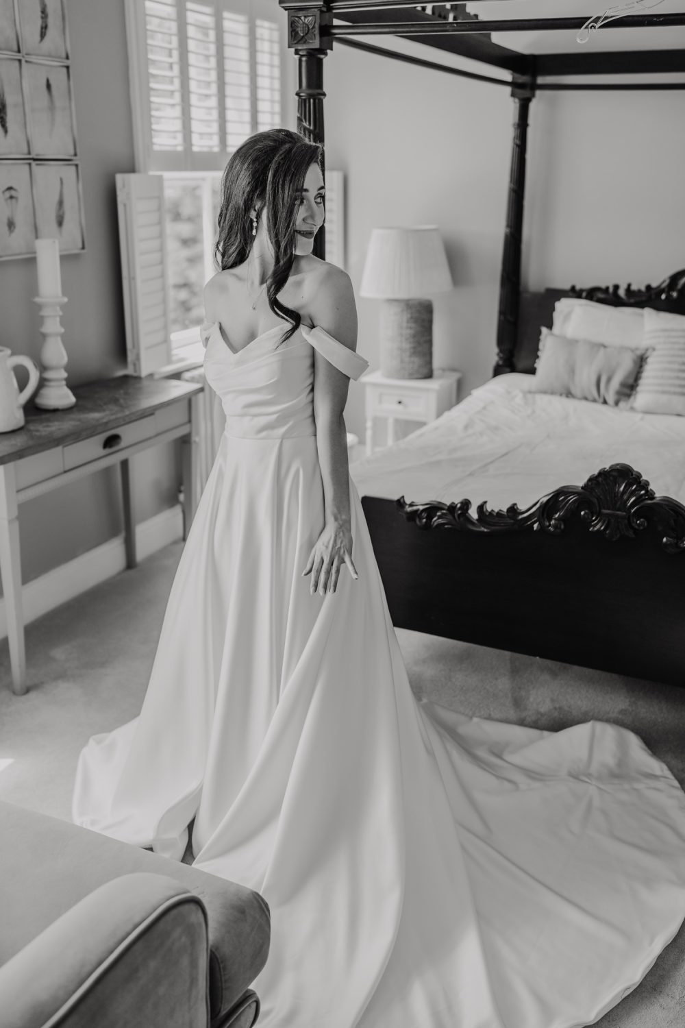black and white bridal portraits in the bedroom at northbrook park wedding venue