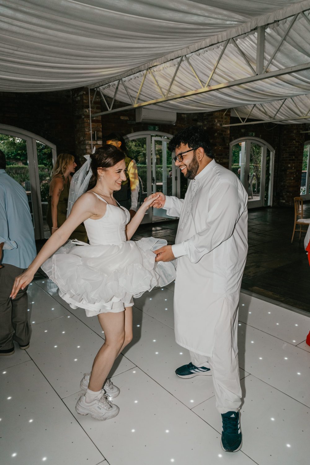 bride and groom on the dance floor at northbrook park wedding venue in surrey