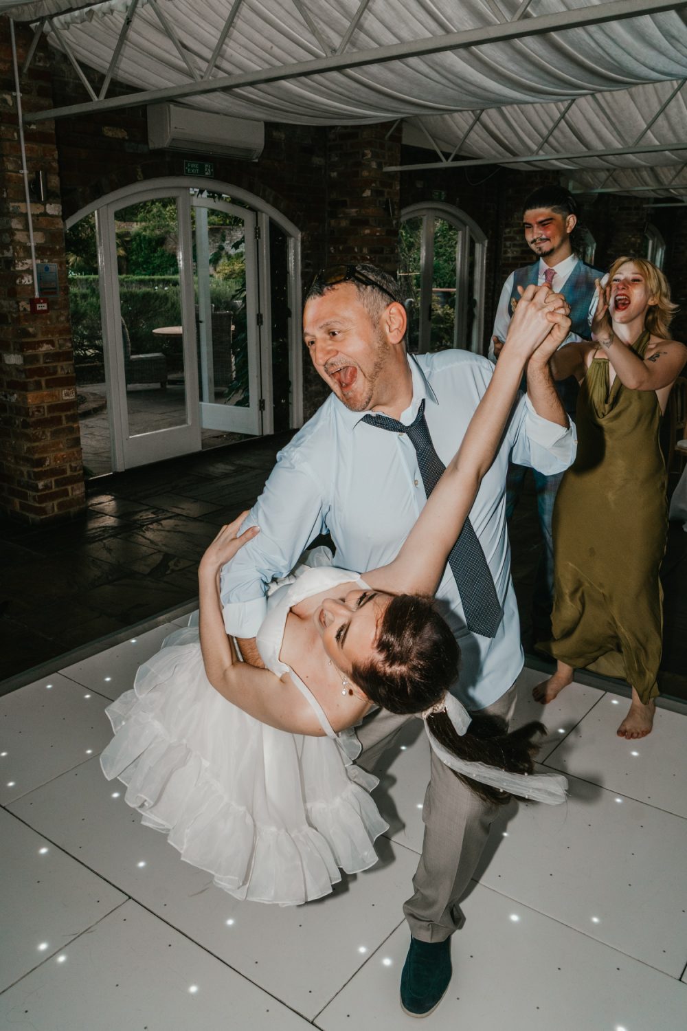 dad dances with daughter at wedding
