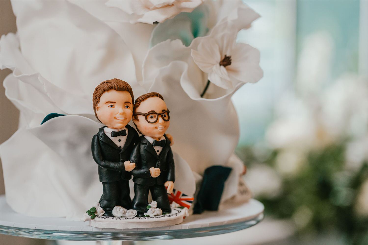 wedding cake grooms topper in the library at trinity house wedding venue in london