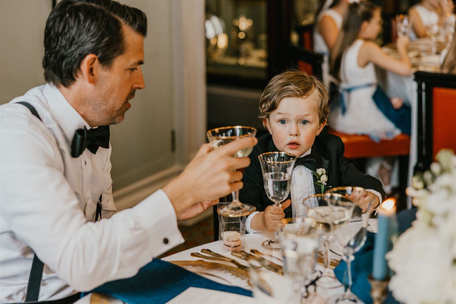 wedding guests reaction to speeches in the library at trinity house wedding venue in london