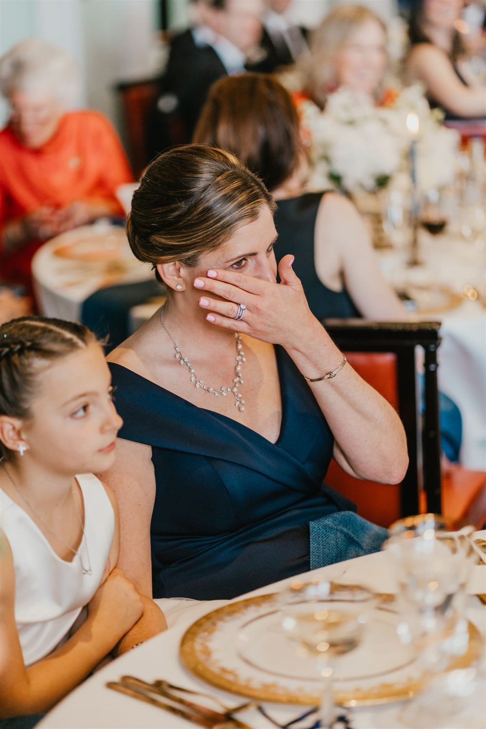 wedding guests reaction to speeches in the library at trinity house wedding venue in london