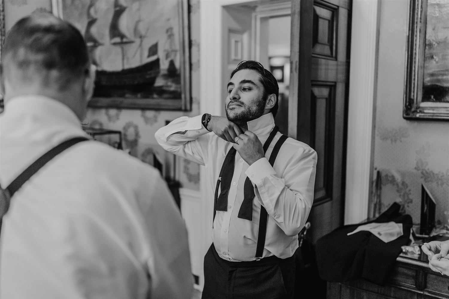 black and white photo of wedding party getting ready at trinity house london wedding