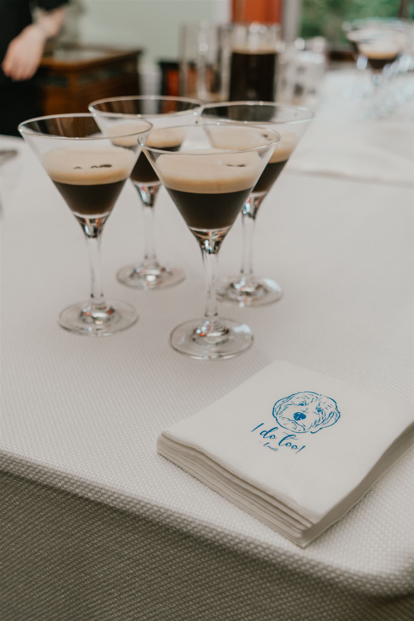 espresso martinis on the bar next to personalised dog napkins