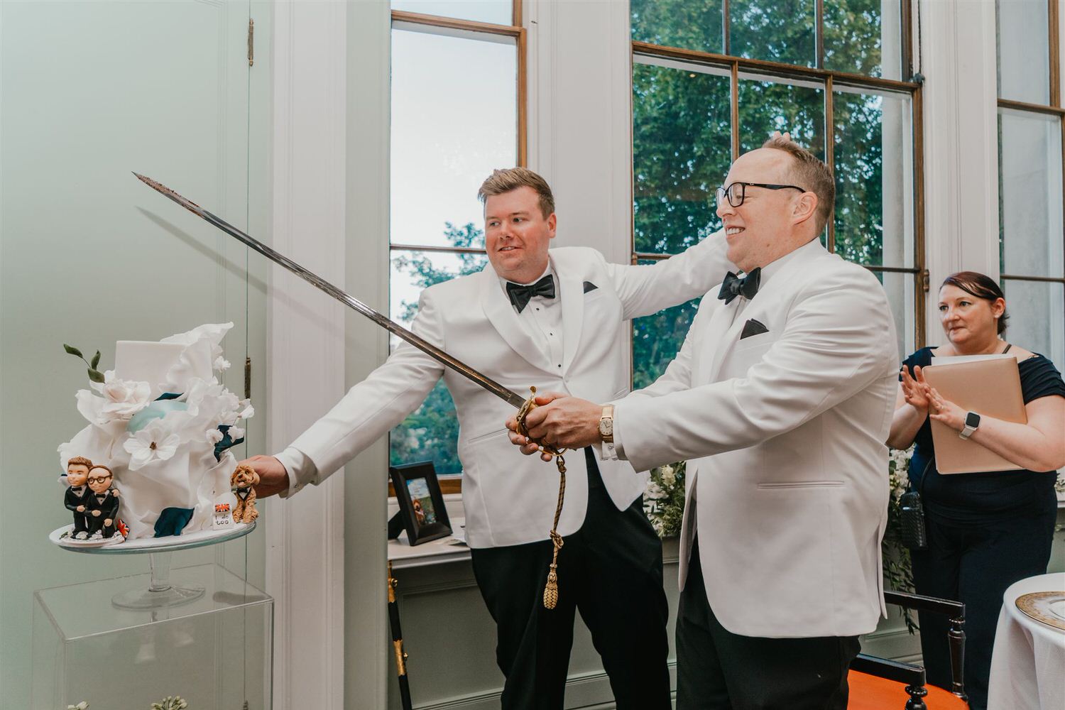 grooms cutting wedding cake at trinity house wedding in london