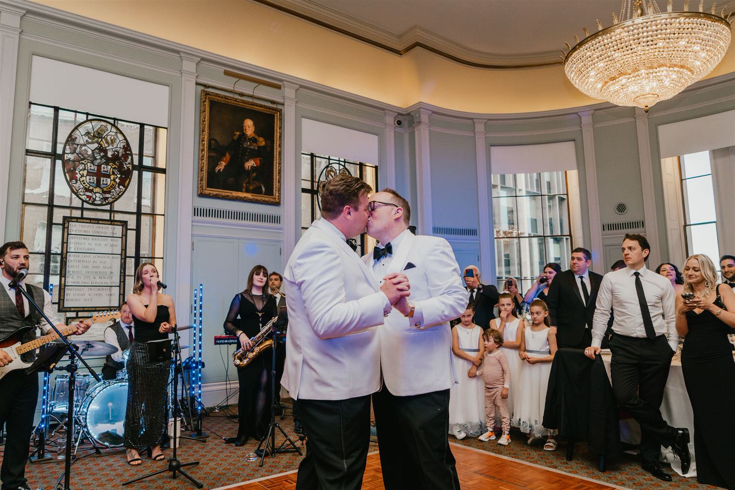 grooms kiss during first dance at trinity house wedding in london