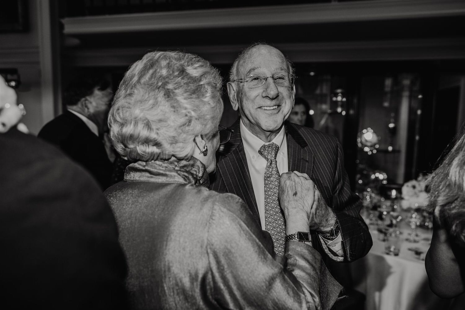black and white photo of wedding guests on the dance floor at trinity house wedding in london