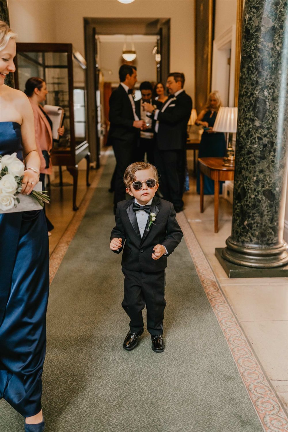 ring-bearer wearing sunglasses at trinity house london wedding