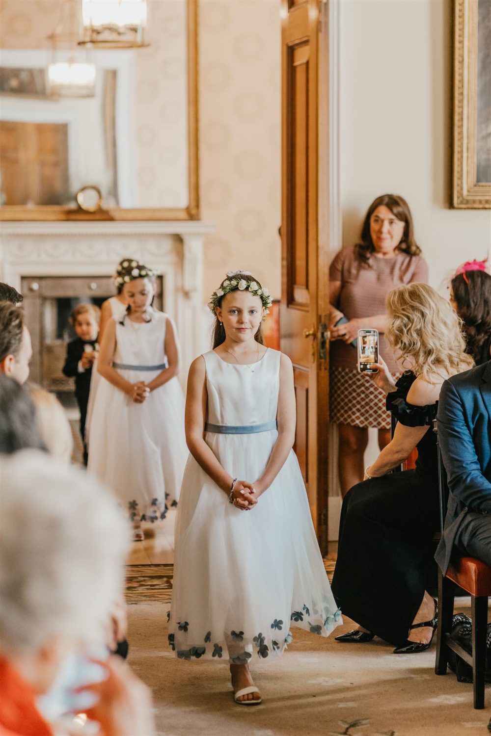 wedding party walking down the aisle at trinity house wedding ceremony in london