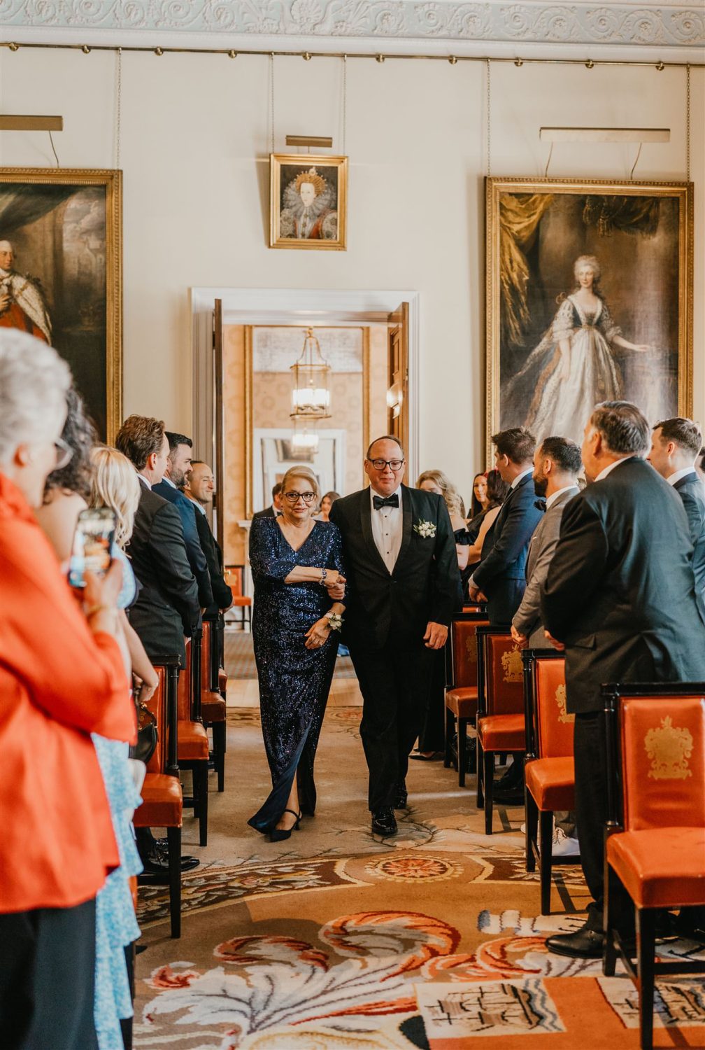 wedding party walking down the aisle at trinity house wedding ceremony in london