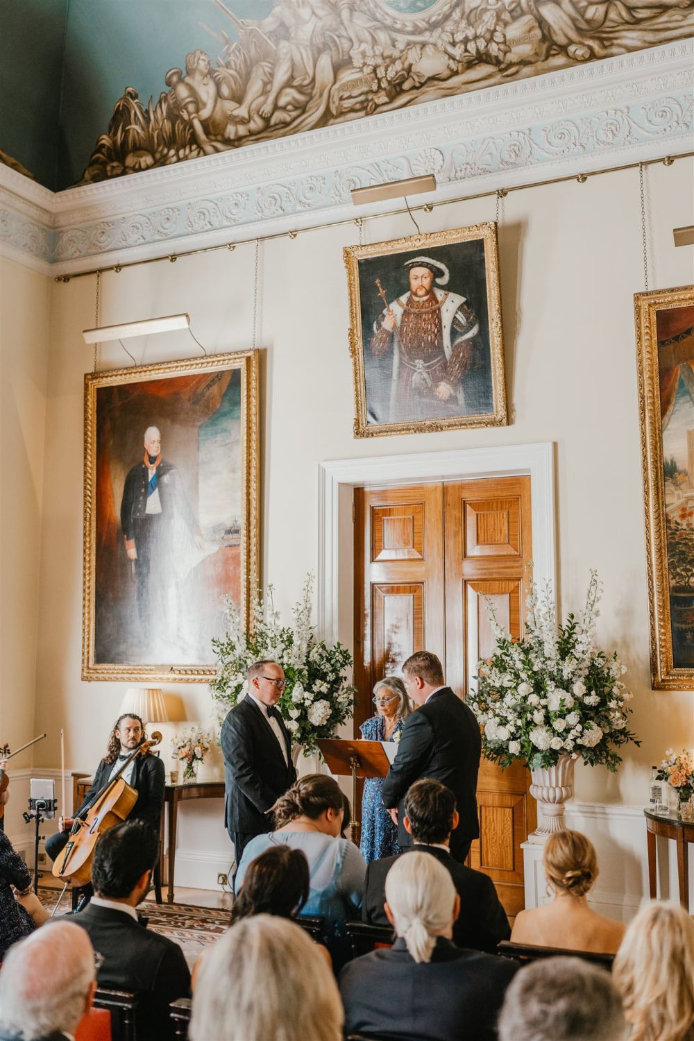grooms standing at the altar during trinity house wedding ceremony in the court room