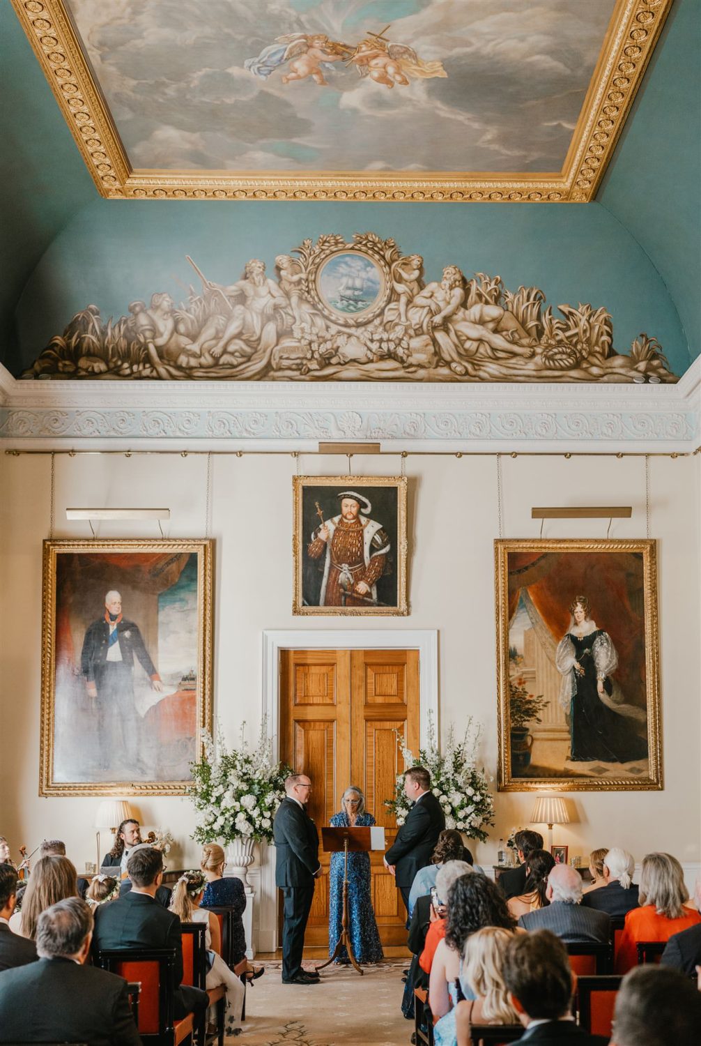 grooms standing at the altar during trinity house wedding ceremony in the court room