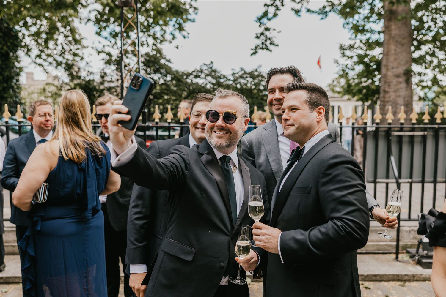 wedding guests taking a selfie outside trinity house wedding in london