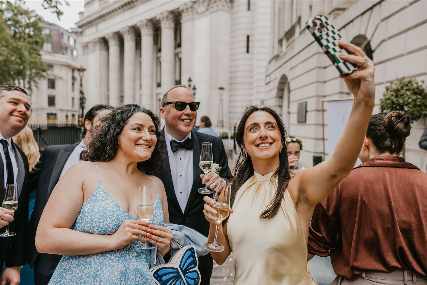 wedding guests taking a selfie outside trinity house wedding in london
