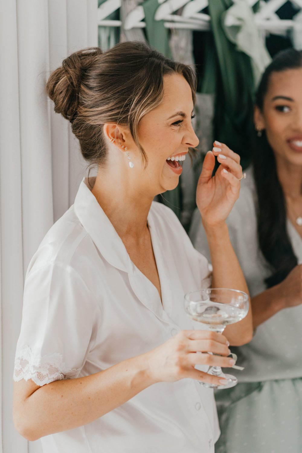 bride drinking champagne on wedding morning