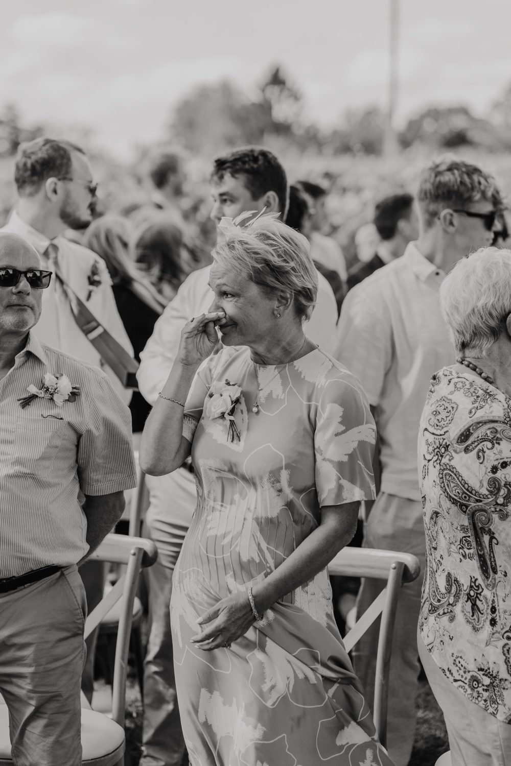 black and white photo of mother of the groom crying