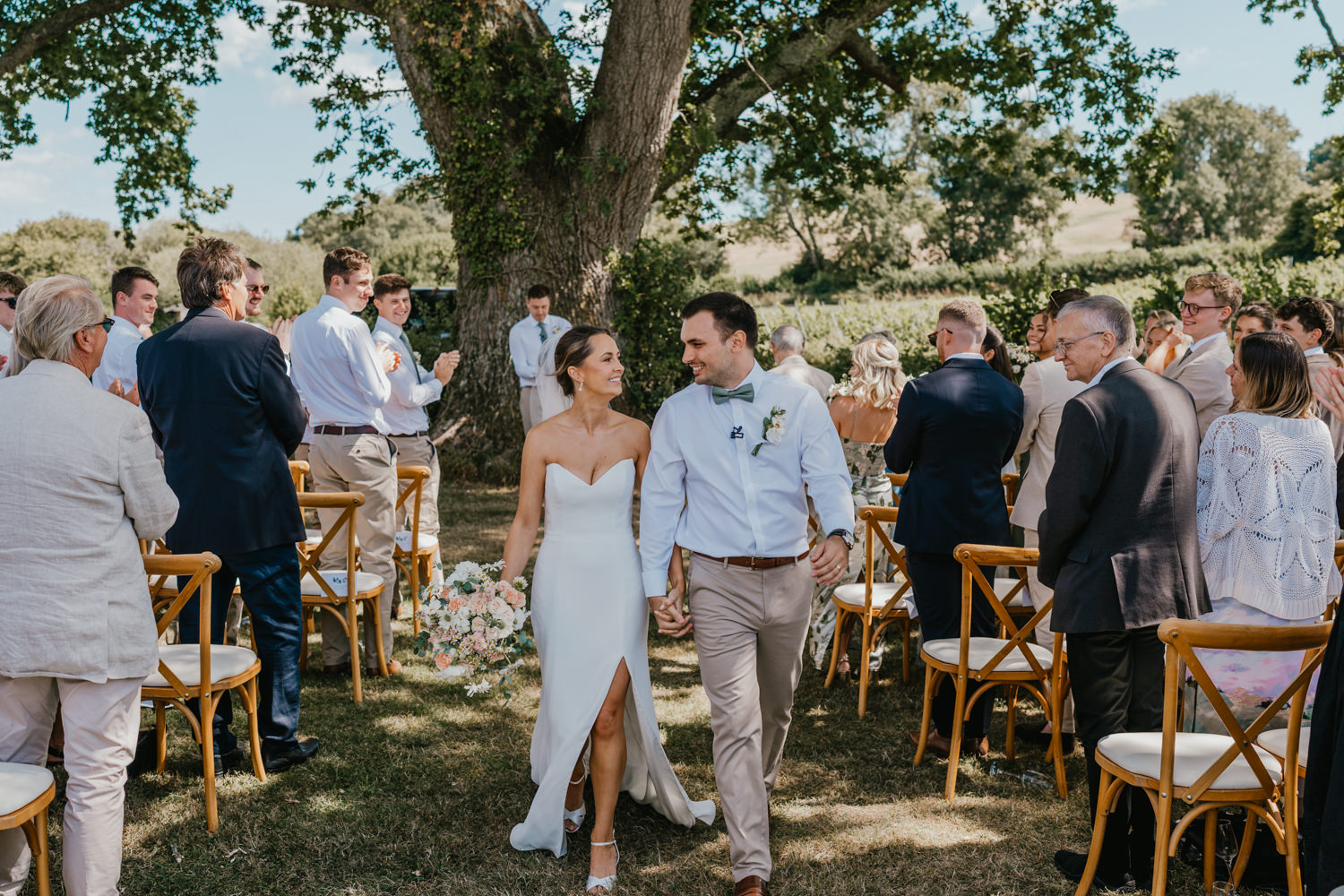 bride and groom recessional at vineyard wedding ceremony at English Oak Vineyard