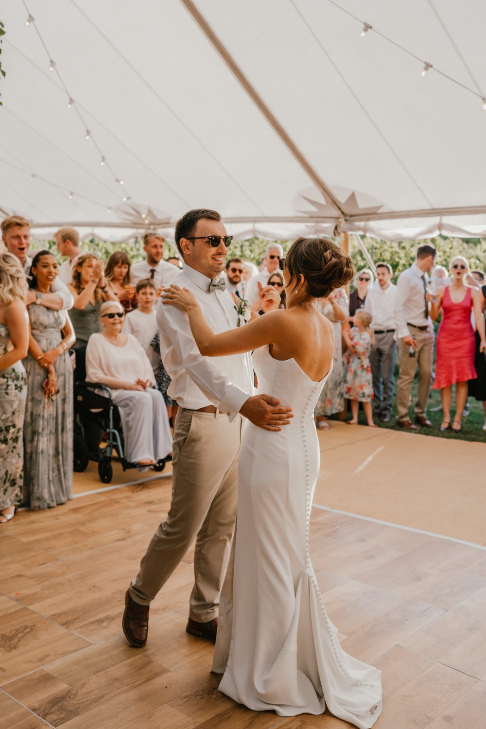 bride and groom first dance in the marquee at English Oak Vineyard wedding in Poole