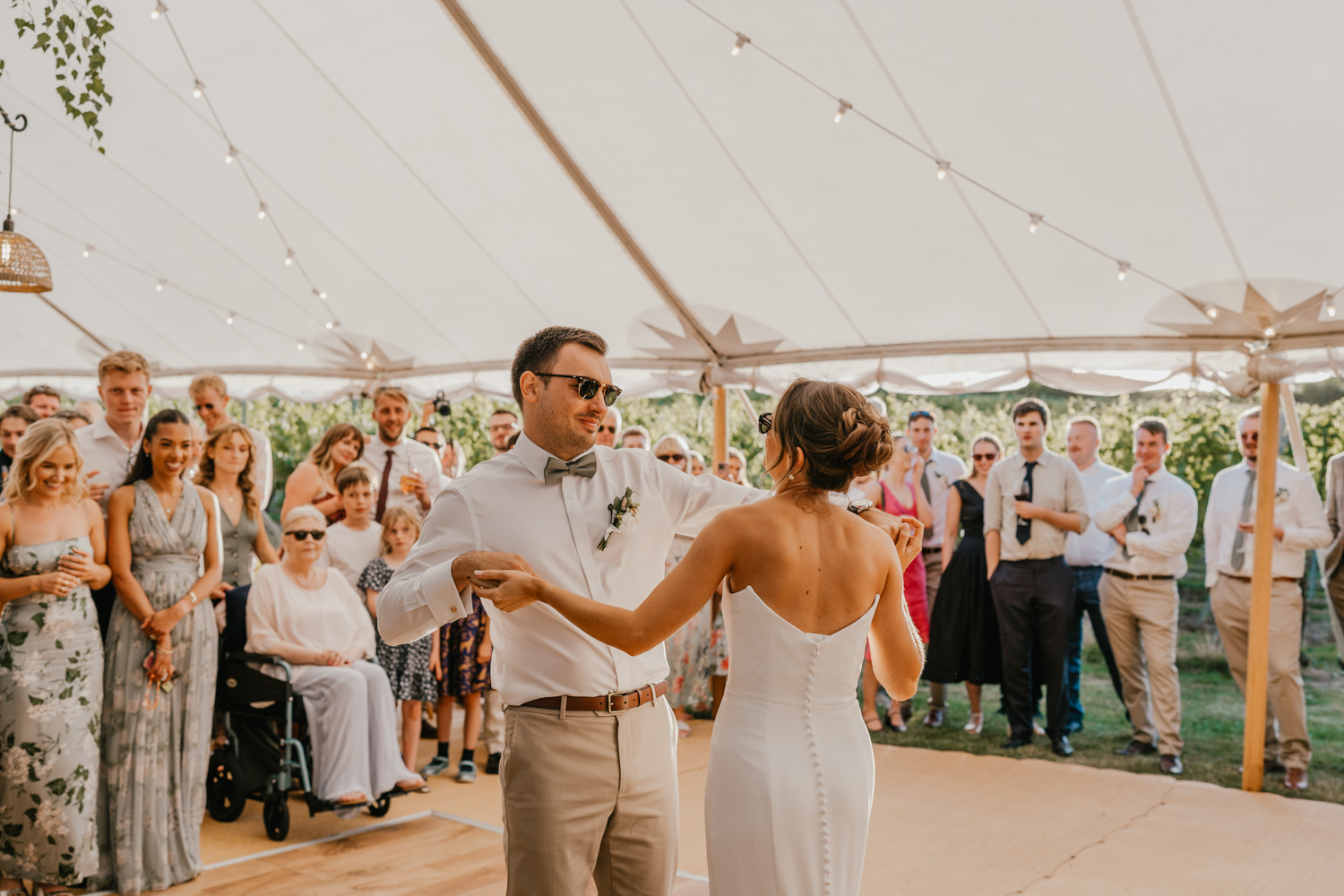 bride and groom first dance in the marquee at English Oak Vineyard wedding in Poole