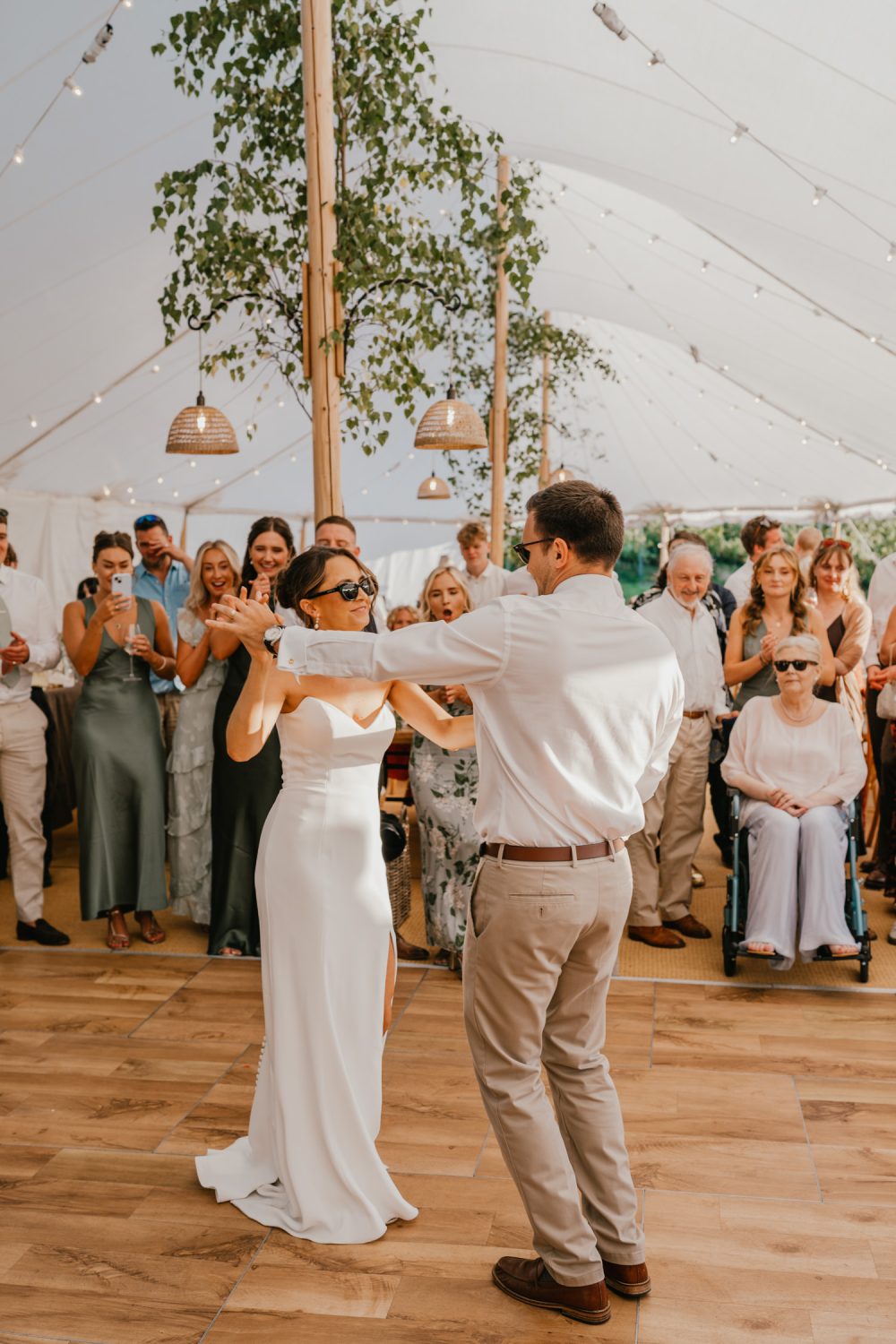 bride and groom first dance in the marquee at English Oak Vineyard wedding in Poole