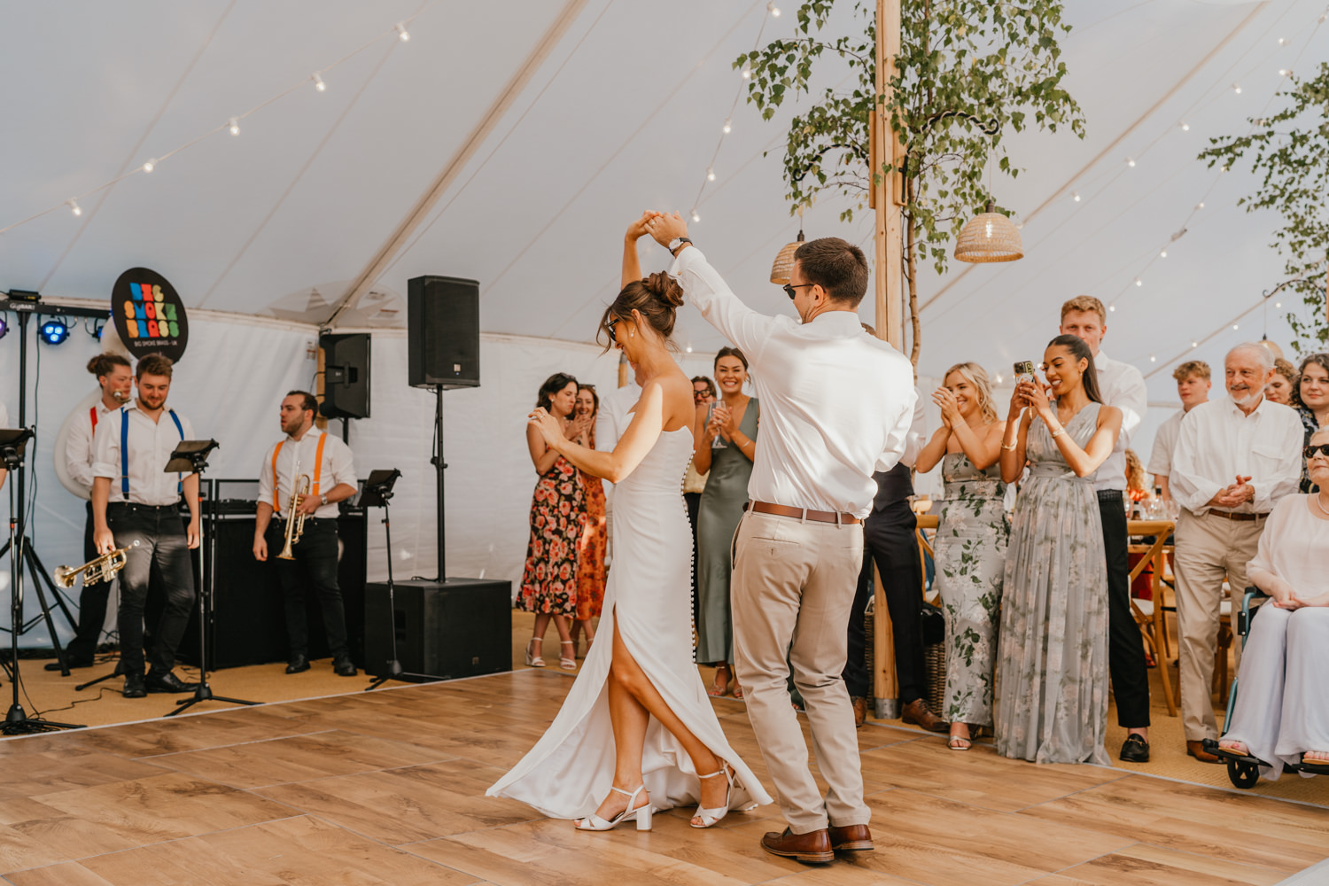 bride and groom first dance in the marquee at English Oak Vineyard wedding in Poole