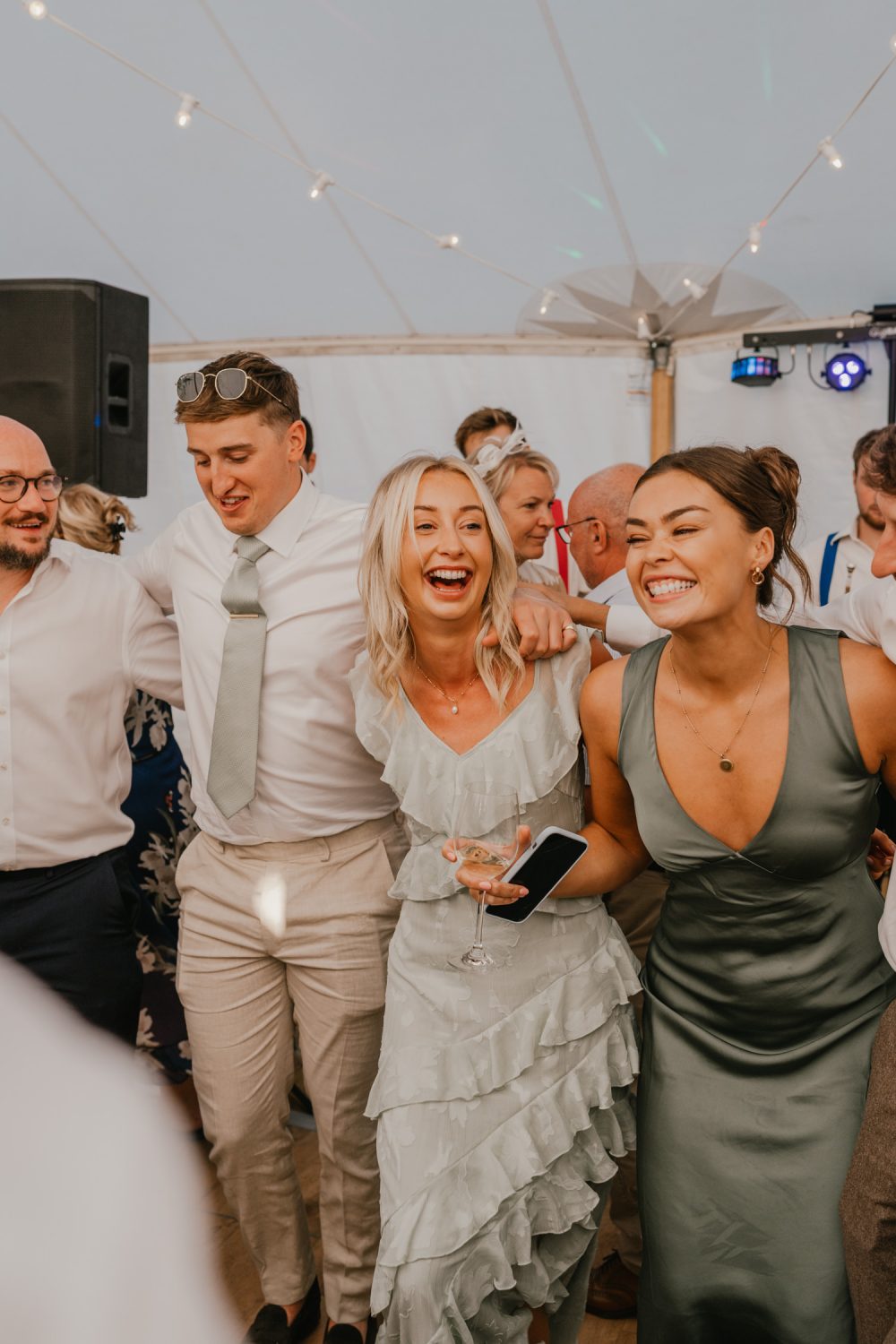 wedding guests on the dancefloor in the marquee at English Oak Vineyard wedding in Poole