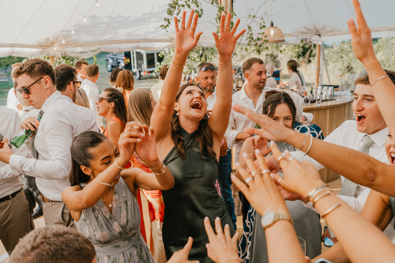 wedding guests on the dancefloor in the marquee at English Oak Vineyard wedding in Poole