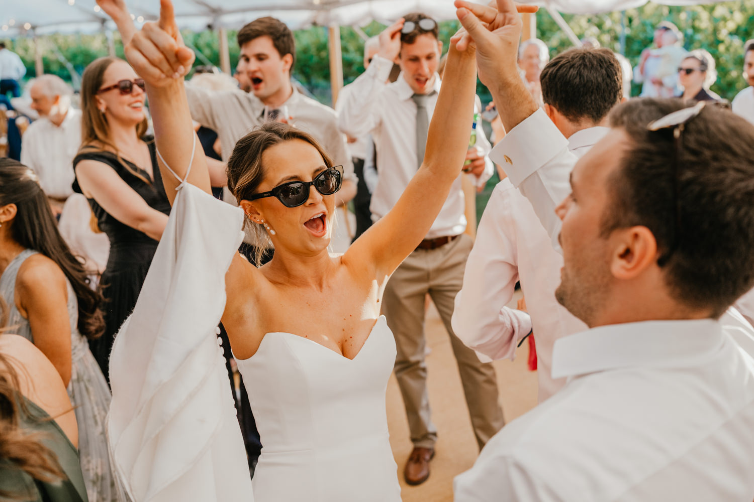 wedding guests on the dancefloor in the marquee at English Oak Vineyard wedding in Poole