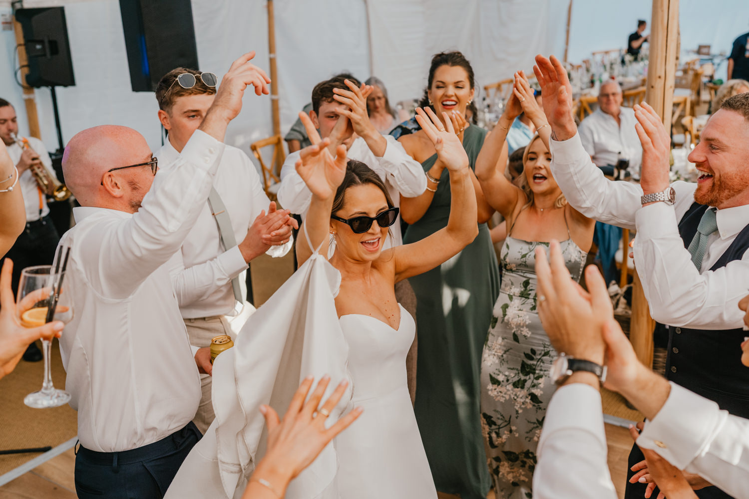 bride parties on the dancefloor in the marquee at English Oak Vineyard wedding in Poole