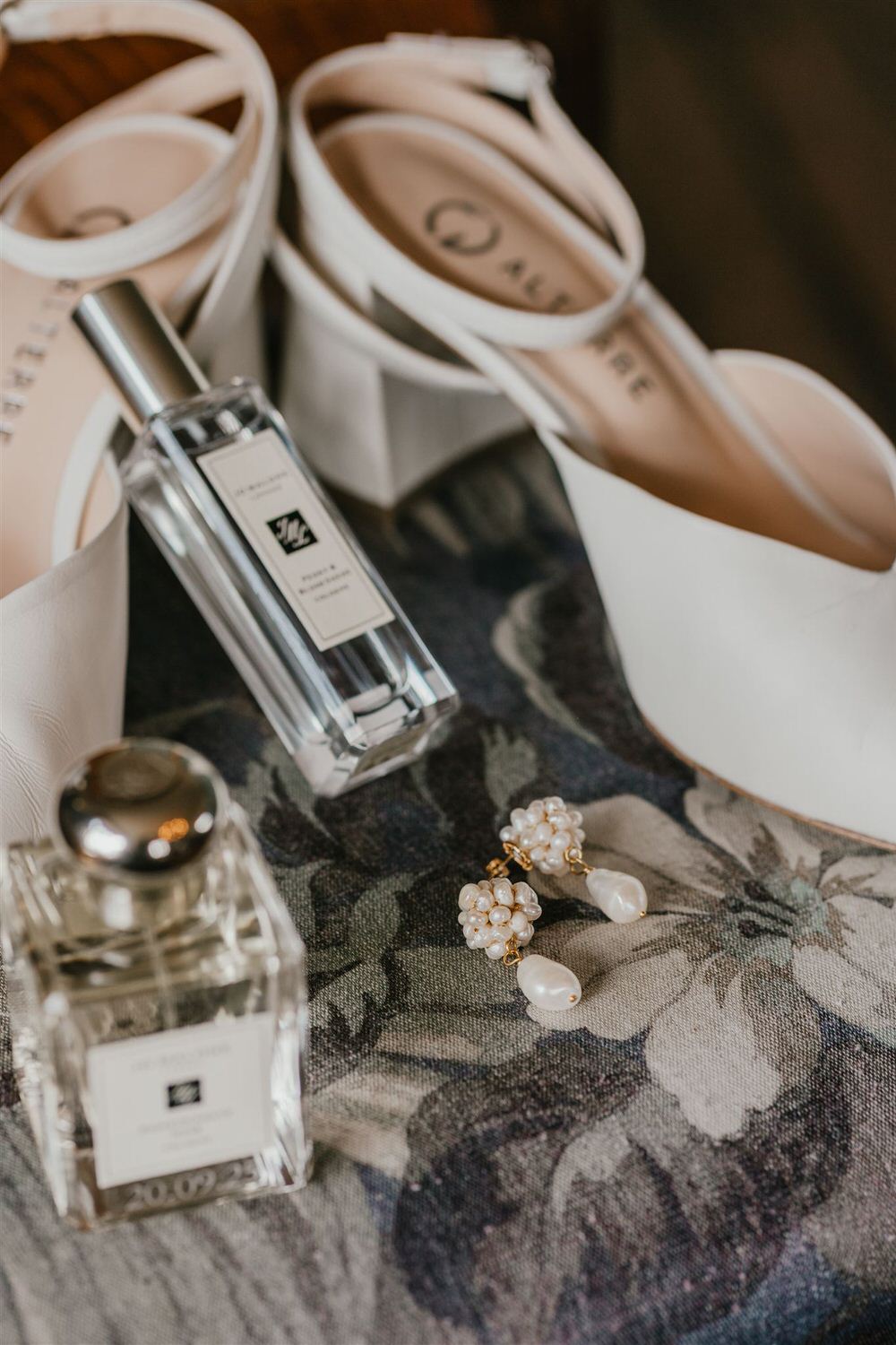 bridal wedding details with pearl drop earrings and jo malone perfume