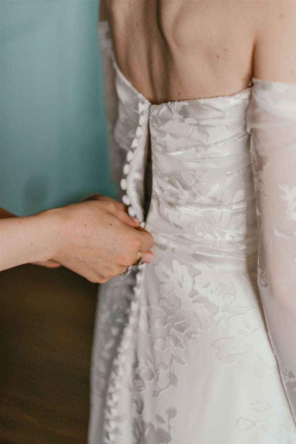 bride getting into wedding dress at the beacon tunbridge wells