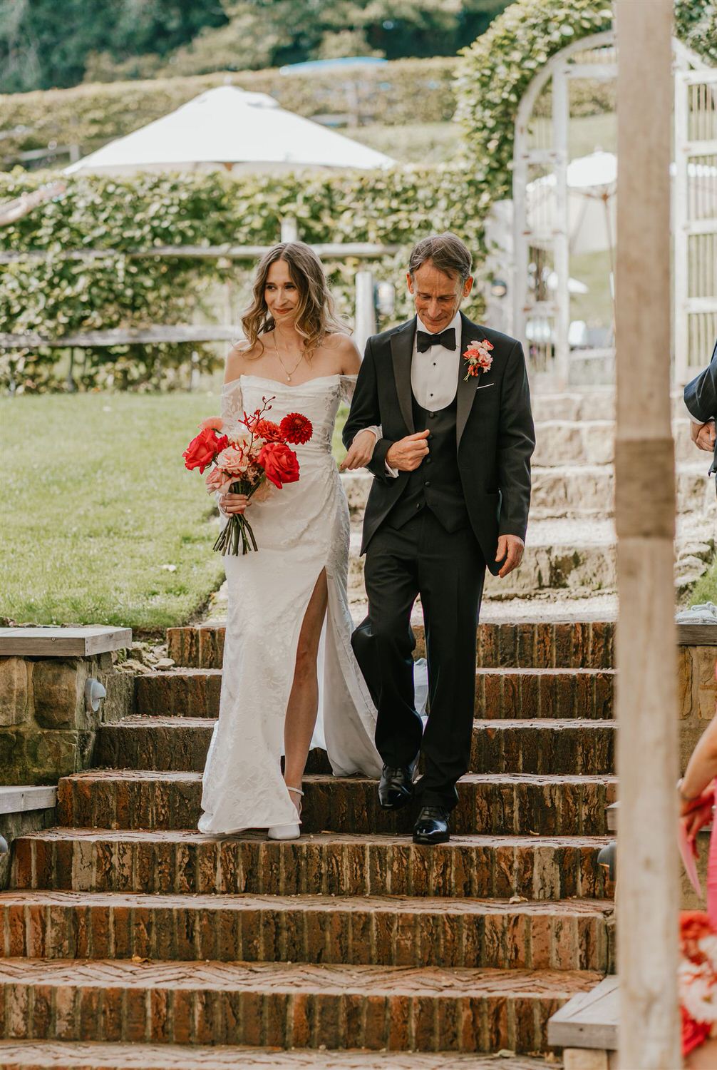 bride walks down the aisle with her father at the beacon tunbridge wells wedding ceremony