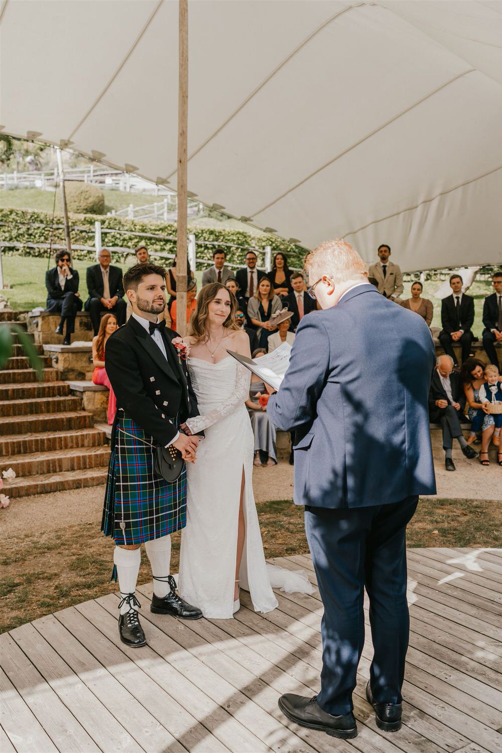 bride and groom hold hands at the beacon tunbridge wells wedding ceremony