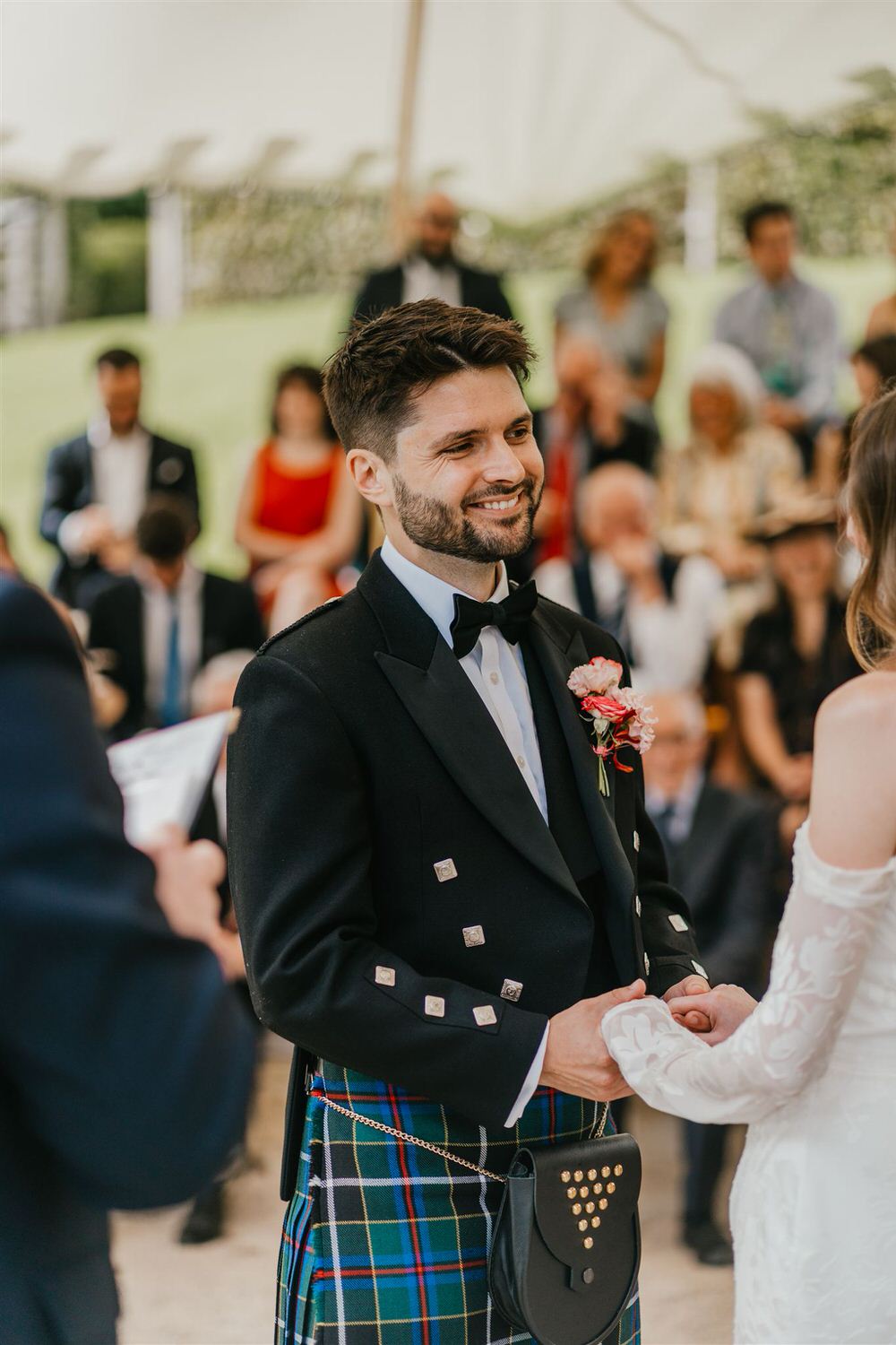 groom holds bride's hands at the beacon tunbridge wells wedding ceremony