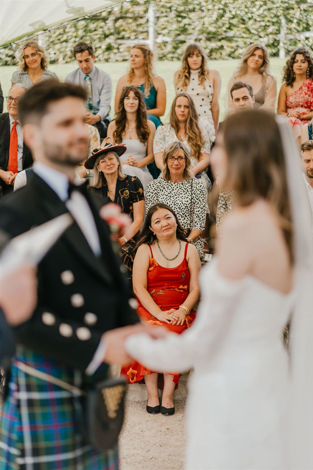 guests watch as bride and groom say their vows at the beacon tunbridge wells wedding ceremony