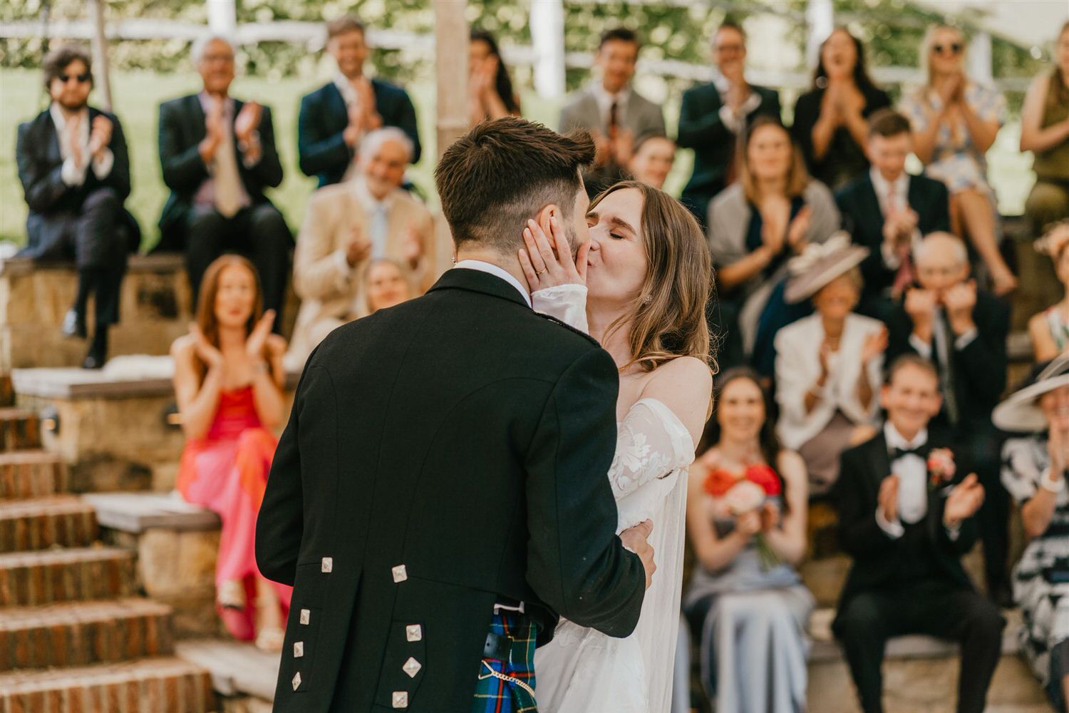 bride and groom first kiss at the beacon tunbridge wells wedding ceremony